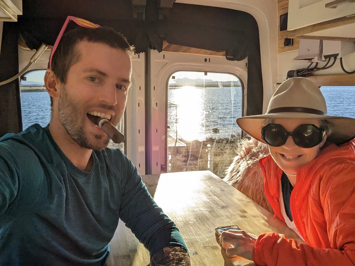 Ian and Carrie Richardson inside Penny, their off-grid converted campervan.